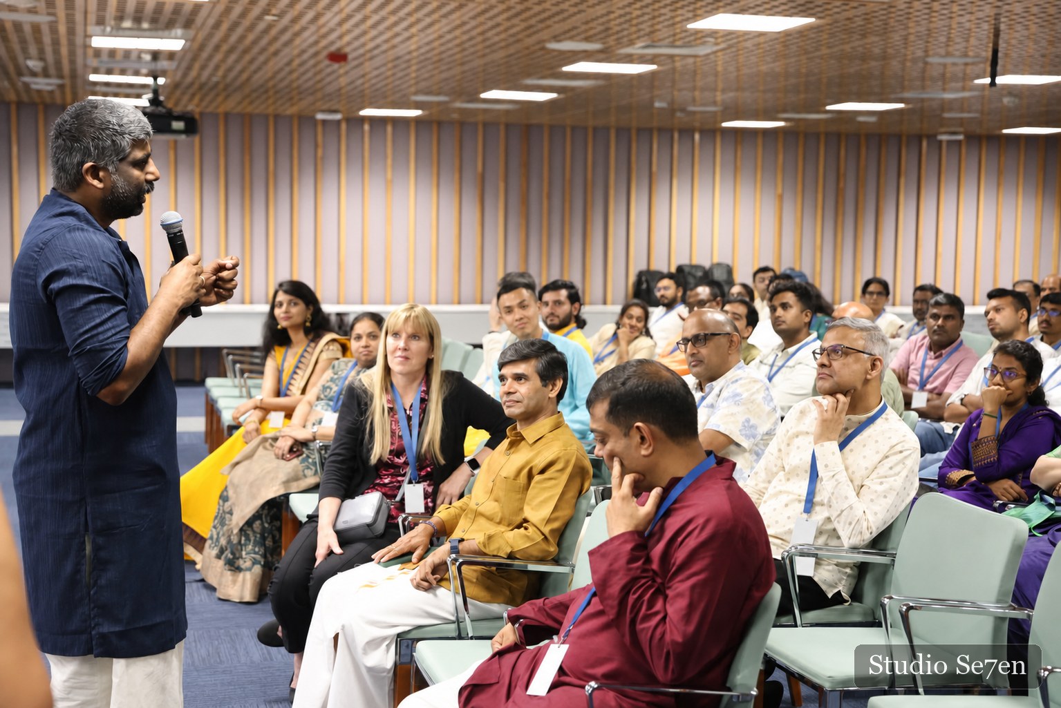 A presenter engaging an attentive workplace audience