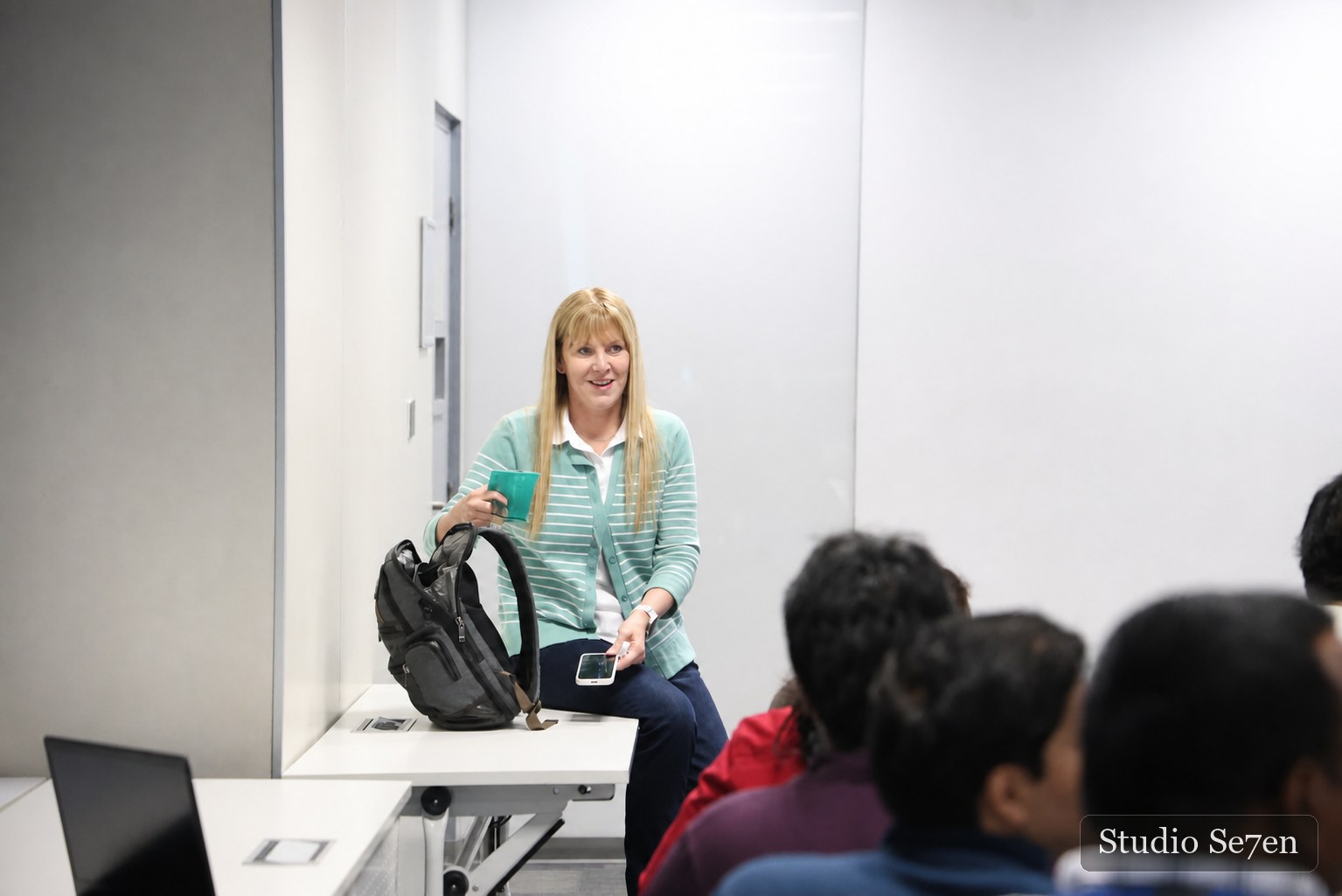 A facilitator speaking to colleagues during a workplace session