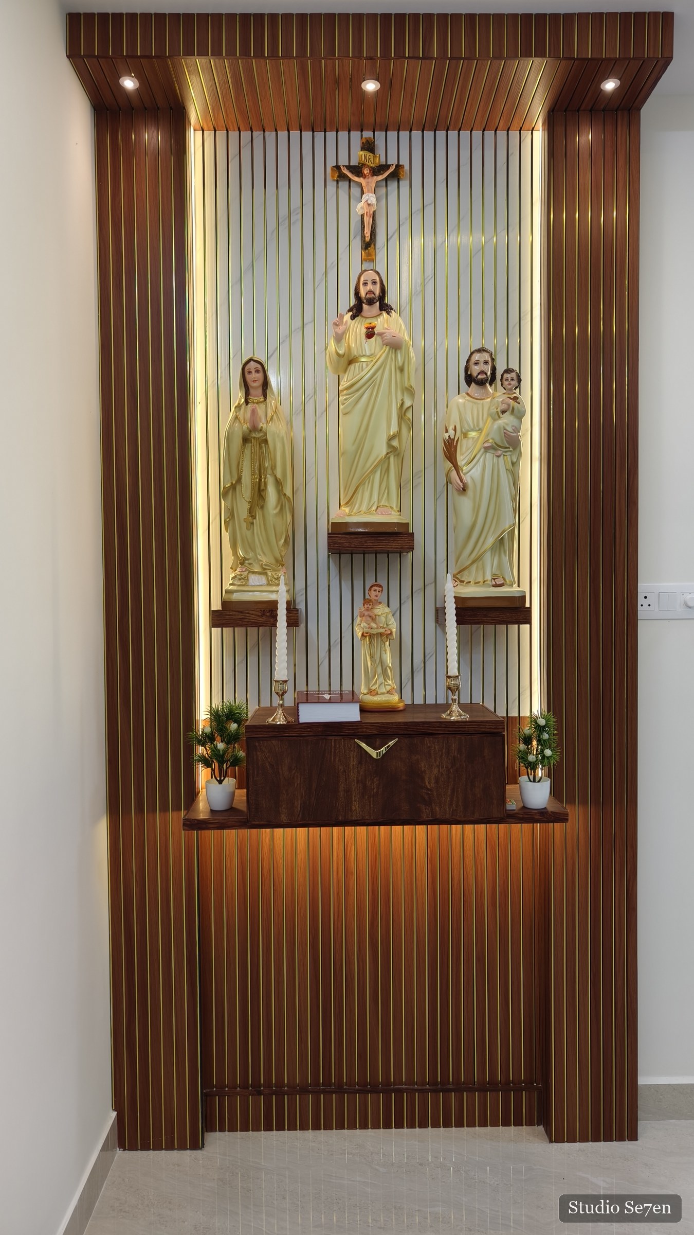 A newly prepared home altar illuminated for a house blessing