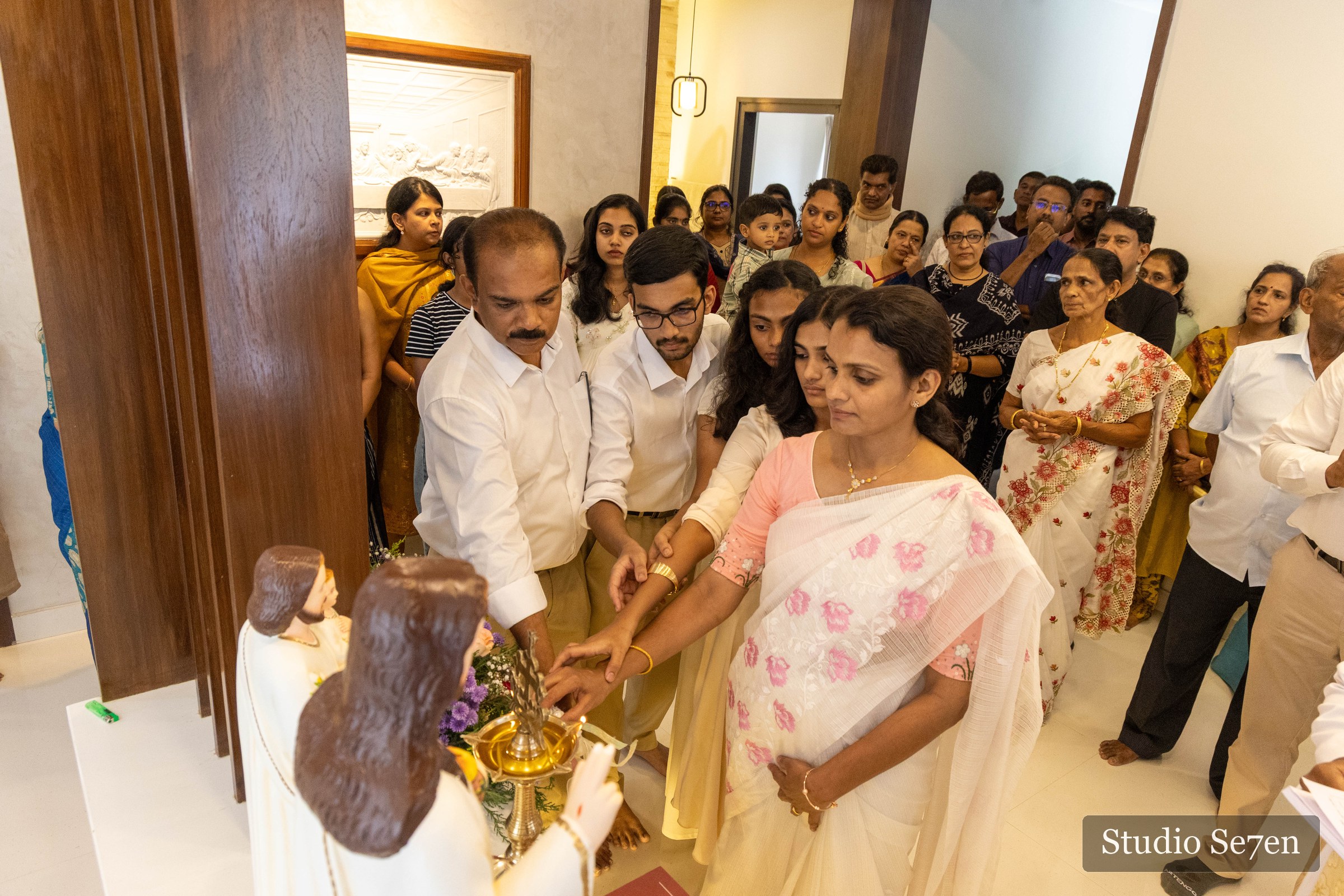 Family and guests gathered for a traditional housewarming blessing