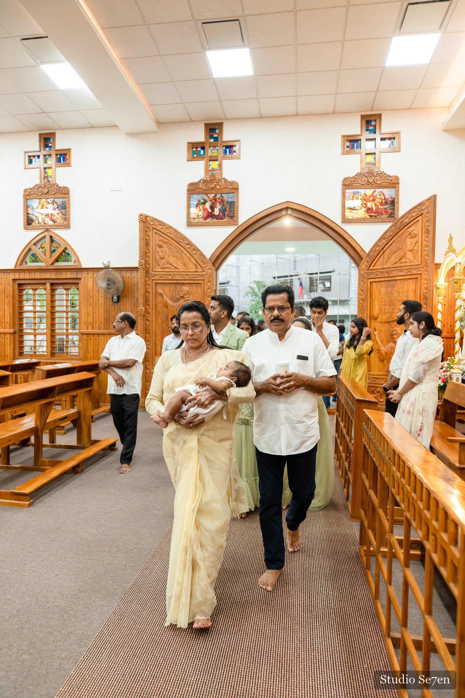 Jazriel and his family entering the church for the baptism ceremony