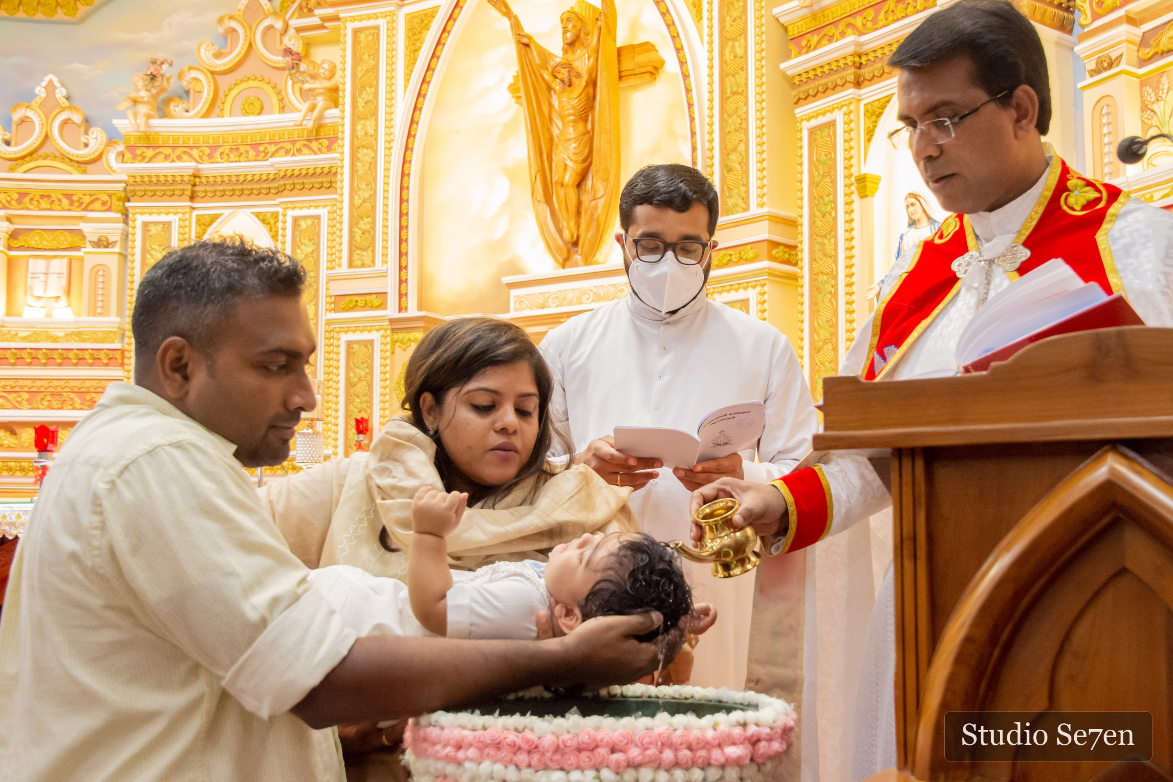 Dave being baptized at the church font as his family gathers close