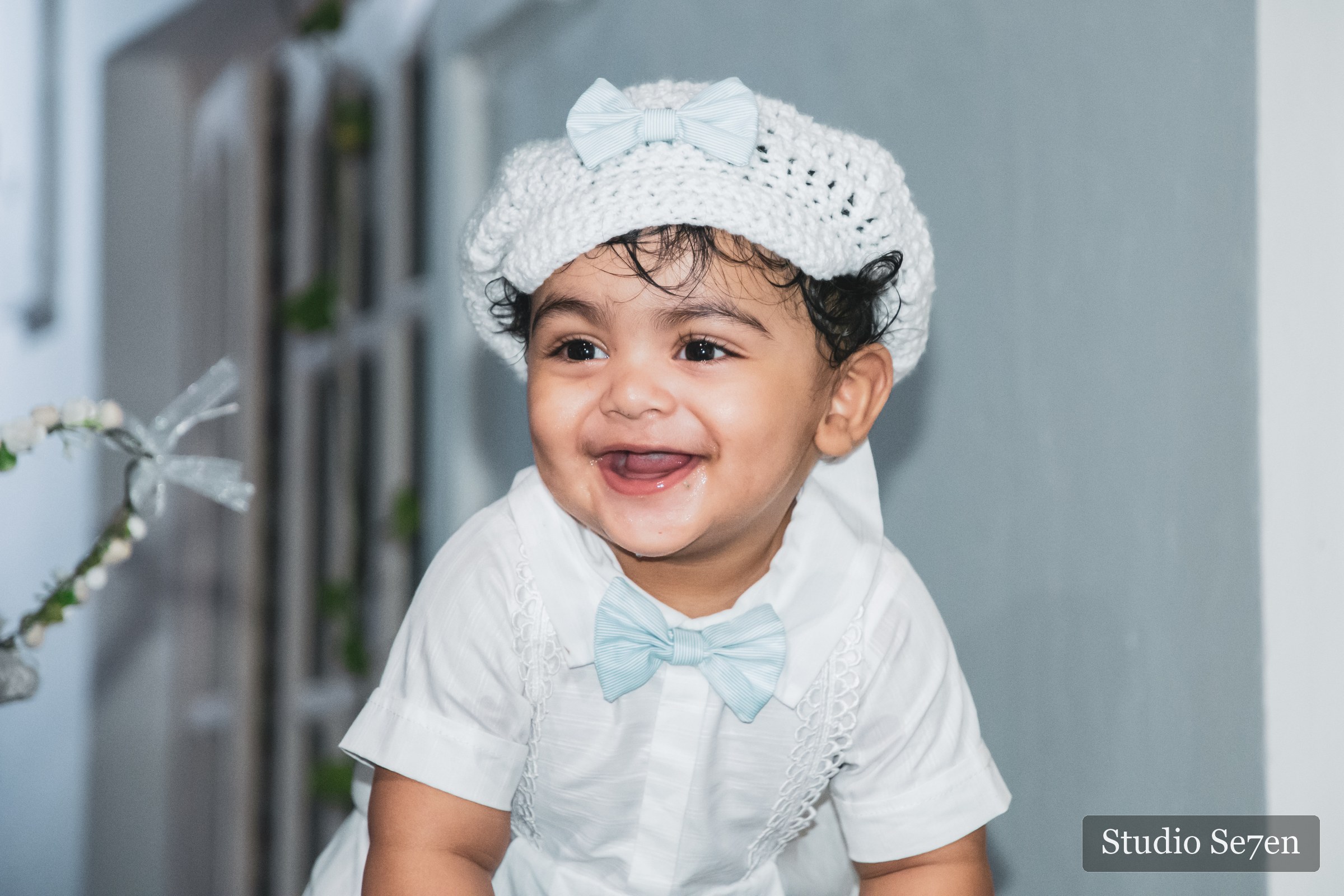 A joyful portrait of Dave in his white baptism outfit