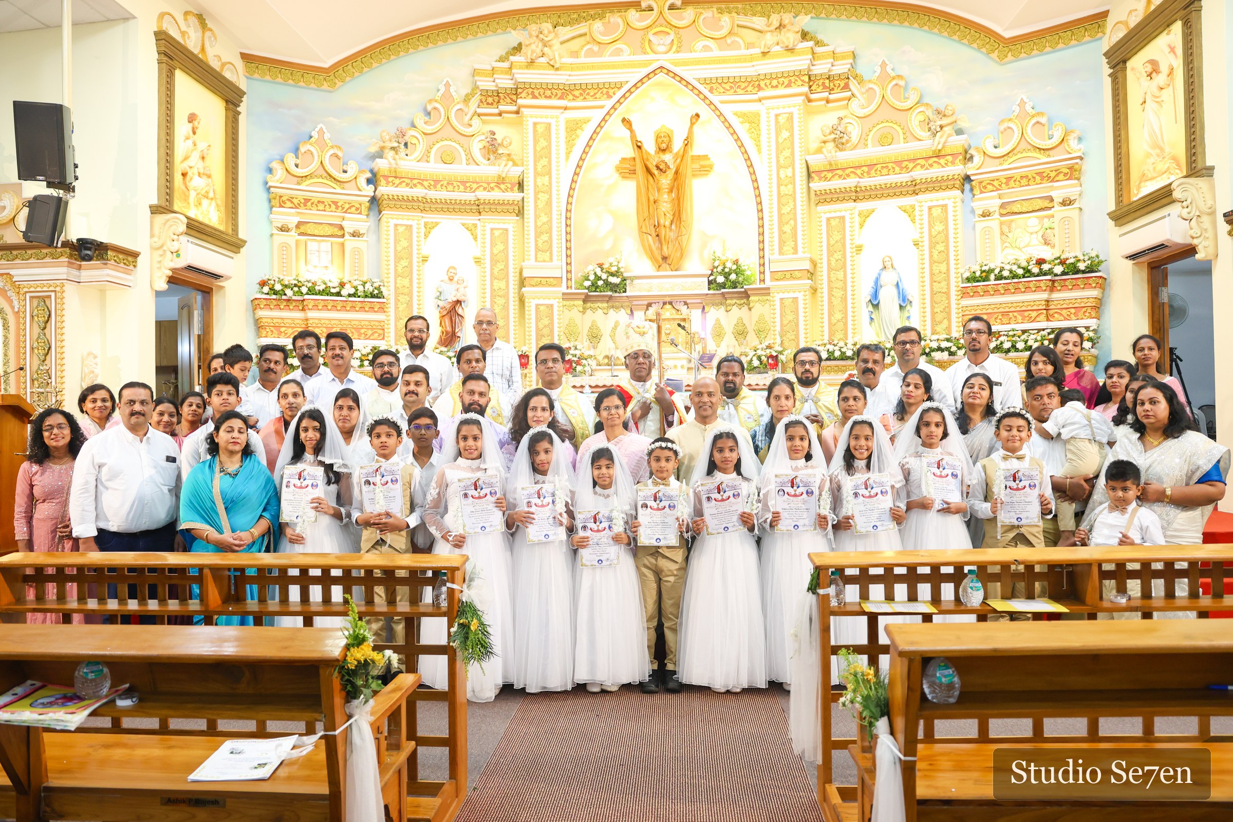First Holy Communion children and families gathered for a church group portrait