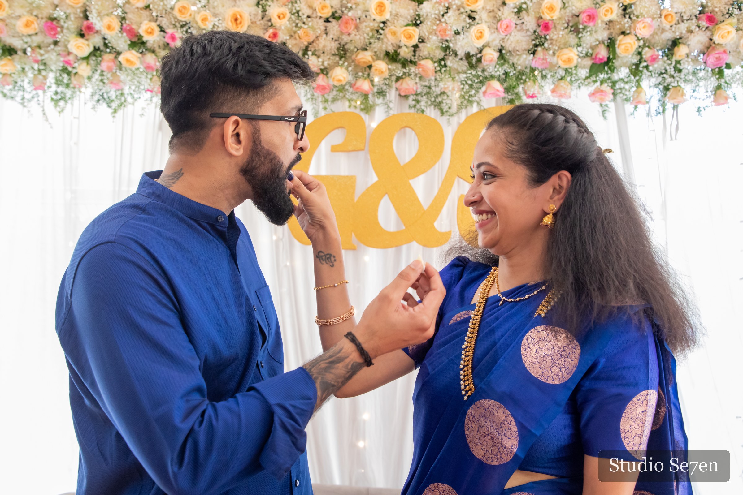 An engaged couple laughing together during their intimate ceremony