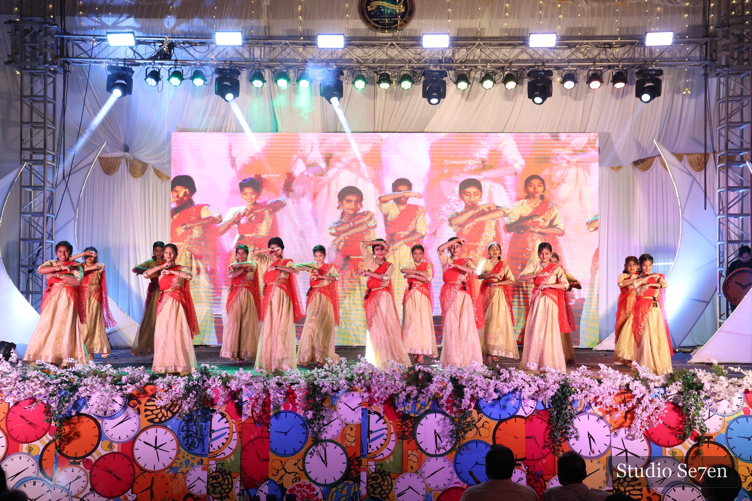 Students performing a coordinated dance at a school annual day